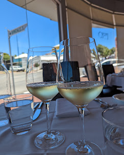 White wine glasses on a table at Prego, BYO wine welcome Tuesday to Saturday